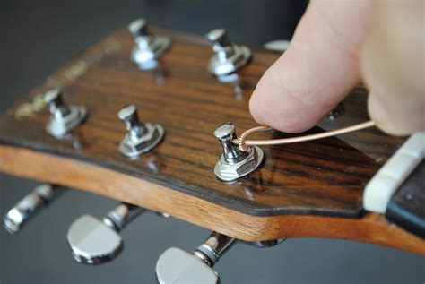 How to Wrap Guitar Strings: A Symphony of Chaos and Order